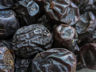Pile of dried dates in a souvenir shop. Lots of dates from Arabia for souvenirs from Hajj. Selected...