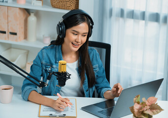 Host channel Asian influencer talking in broadcast streaming online wearing headset on social media...