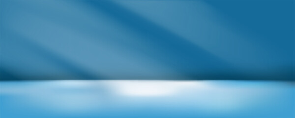 Empty blue studio with gradient sunlight from windows on the background and floor. Dark room backdrop for product display or stage for performance.