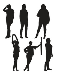 Set of black silhouettes of a girl in different poses. Vector illustration