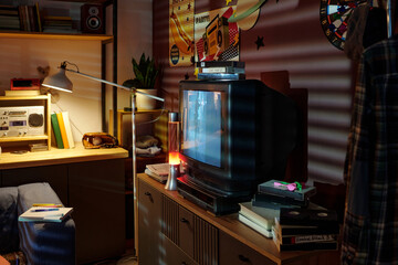 Vintage living room setup with retro TV set, bookshelf filled with books and decorations, and an analog radio. Warm lighting creating a cozy ambiance, enhancing the nostalgic feel