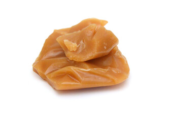 Caramel candies isolated on white background