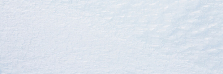 Natural snow texture. Smooth surface of clean fresh snow. Snowy ground. Winter background with snow...