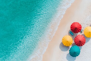Obraz premium An aerial view of a pristine beach with golden sand, colorful umbrellas, and waves gently lapping the shore