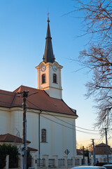 Obraz premium Church of Saint John the Baptist in Ivanka pri Dunaji, Slovakia at sunset