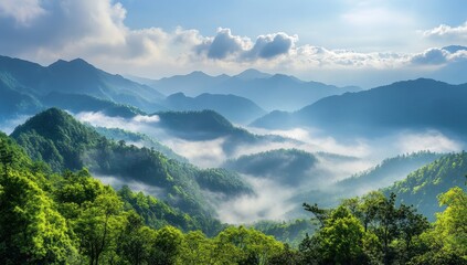 Fototapeta premium Majestic Mountain Landscape with Lush Green Forest and Soft Morning Mist Under a Bright Blue Sky, Scenic View of Nature's Beauty and Tranquility