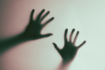 Abstract Shadow Hands on Pink and Green Background