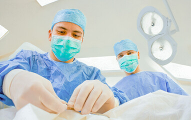 Surgeons Performing a Medical Surgery in an Operating Room Environment