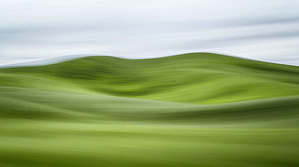 A serene abstract landscape featuring smooth, rolling hills in vibrant green tones, evoking a sense of tranquility and natural beauty.
