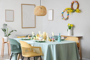 Festive table setting for Easter celebration in kitchen