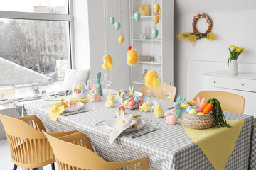 Interior of dining room with beautiful table setting for Easter celebration