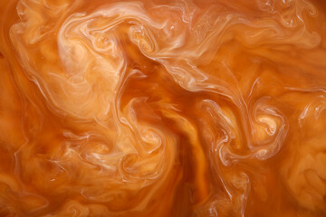 Texture of coffee with milk as background, closeup