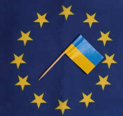 Ukrainian flag against the background of the European Union flag