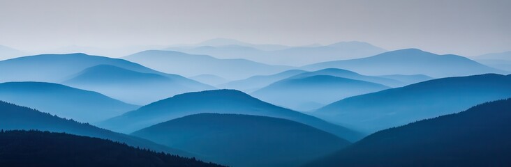 Fototapeta premium Serene Landscape of Rolling Hills with Soft Blue Tones Under a Misty Sky for Tranquil and Calming Aesthetic in Nature Photography