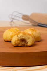 Close up of traditional nastar cookies on a wooden cutting board