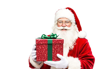 Santa Claus in a red suit holding a festive red gift box with a green ribbon, smiling joyfully. Isolated on a white background. Holiday celebration concept. Ai generative