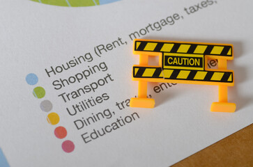 Budget Planning Alert: Caution Symbol on Personal Finance Worksheet
