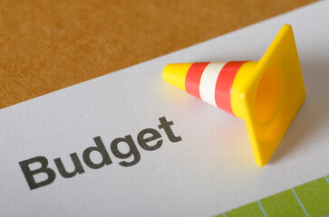 Budget Planning Alert: Caution Symbol on Personal Finance Worksheet