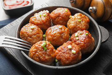 Tasty meatballs served on grey table, closeup