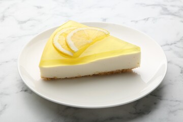 Piece of tasty lemon cheesecake on white marble table, closeup