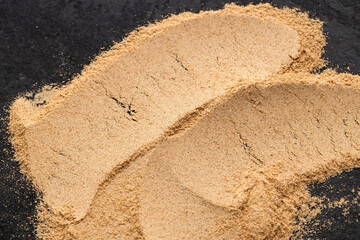 Lepidium meyenii - Heap of dried Peruvian maca powder.