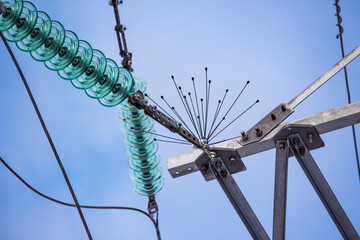 Bird protection and glass insulators on a power transmission line pole