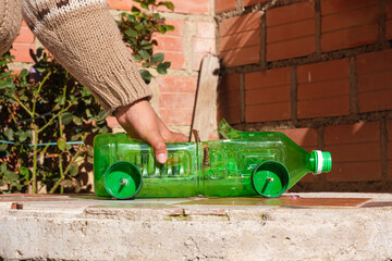 car made of recycled plastic bottle in la paz -bolivia latin america - recycling concept