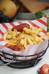 Delicious fries topped with sausage in a vibrant setting