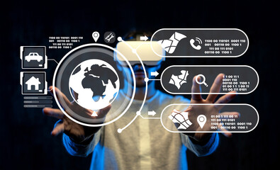 Virtual Reality User Interacting with Futuristic Interface and Digital Globe in Dark Atmosphere