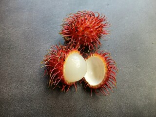 Fresh rambutans on dark background