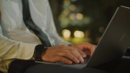 Business man hands typing on laptop computer keyboard, searching information, surfing the internet on desk, business and technology concept.