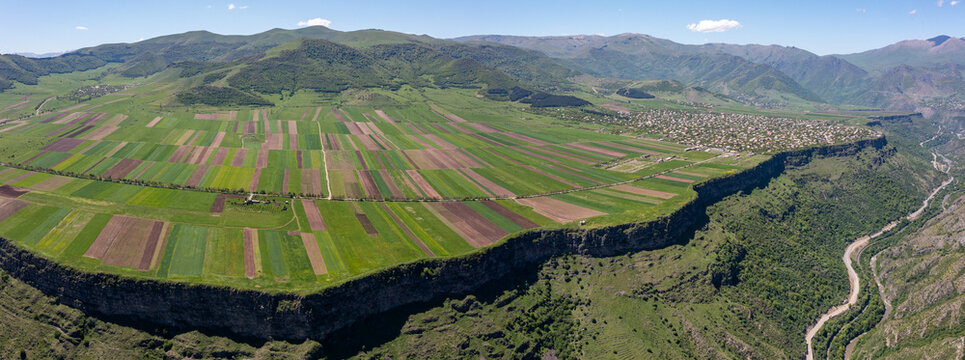 180 degree Aerial view of Debed River canyon and colorful agricultural fields near Odzun, Alaverdi, and Vanadzor in Lori province, Armenia, during spring and summer