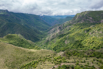 Aerial drone photo of Vorotan River Canyon near Tatev monastery stretched until Goris, the deepest canyon in Armenia, a popular travel and hiking destination with dramatic landscapes and lush greenery