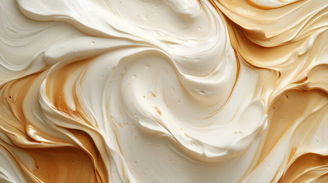 A smooth, swirled mixture of creamy white and caramel tones, creating a rich and textured abstract pattern.