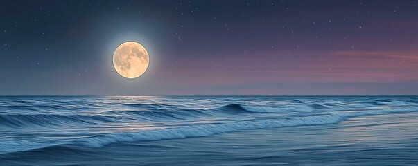 A large full moon shines over a calm ocean at night