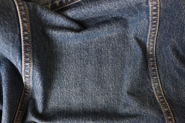 Naklejka premium seam of blue denim texture background, jean fashion style