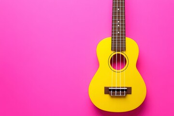Obraz premium Yellow Ukulele on Vibrant Pink Background