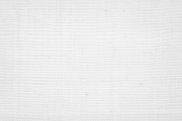 White fabric jute hessian sackcloth canvas woven gauze texture pattern in light white color blank. Natural linen and cotton cloth texture as clean background empty for decoration.