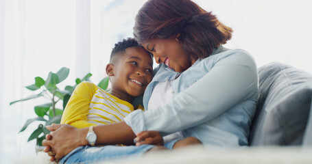 Obraz premium Support, mom and forehead touch with kid in home for trust, care and African family bonding together. Mama, child and embrace happy boy on lap for love or relationship with parent on mothers day