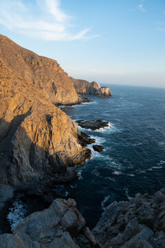 Punta Lobos in BCS, Mexico, golden hour. Rocky shore cliffs next to the Pacific Ocean