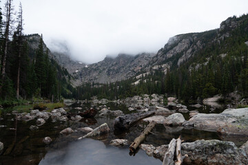 Misty morning view of lake and mountains in Rocky Mountain National Park