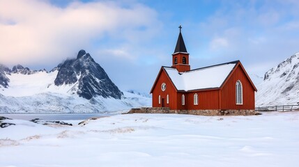 Fototapeta premium Flakstad Kirke church standing in snowy landscape in Lofoten Islands, Norway