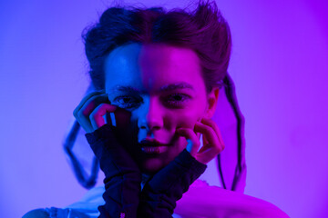 A futuristic portrait bathed in neon blue and pink light, highlighting a dramatic expression, avant-garde fashion, and an intense, dreamlike mood filled with depth and emotion