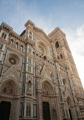 The Florence Cathedral, or Duomo di Firenze, with its intricate marble facade and bell tower.
