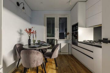 Modern Kitchen with Elegant Dining Area and Natural Light