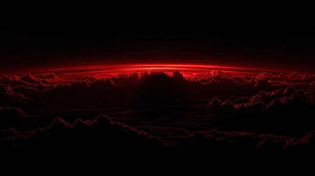 Red Glowing Horizon Over Dark Cloudscape at Night