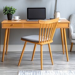 A modern workspace with wooden desk chair and laptop computer