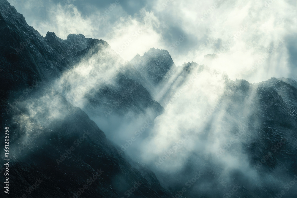 Poster sunbeams pierce through a misty mountain range, creating a dramatic and ethereal scene.