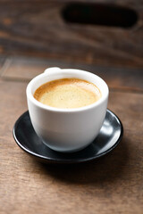 Cup of coffee on wooden background. Soft focus. Copy space	