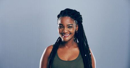 Smile, creative and portrait of African woman in studio with mockup space, confidence or hair...